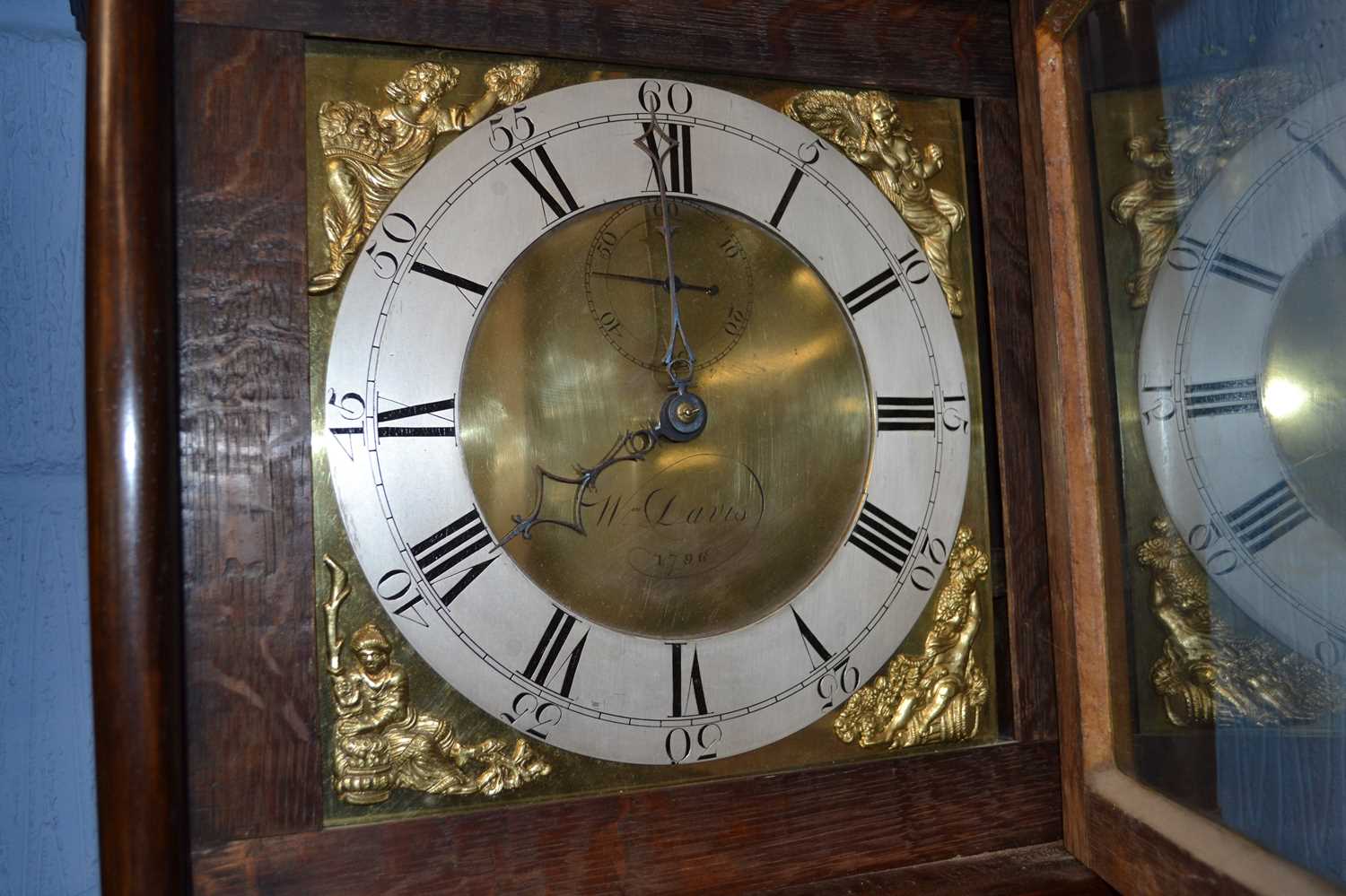 A Georgian oak cased long cased clock with square brass dial with figural spandrels, the face signed - Image 2 of 2