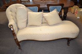 A Victorian walnet framed chaise longue with button upholstered back, serpentine front and
