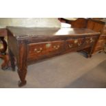 Large 18th Century oak dresser base with three drawers with brass swan neck handles, supported on