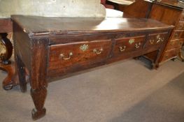 Large 18th Century oak dresser base with three drawers with brass swan neck handles, supported on