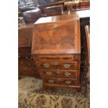 Small Georgian style walnut bureau of narrow form with full front opening to an interior with