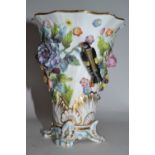 A 19th Century English porcelain spill vase, decorated in relief with flowers and birds, 12cm