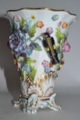 A 19th Century English porcelain spill vase, decorated in relief with flowers and birds, 12cm