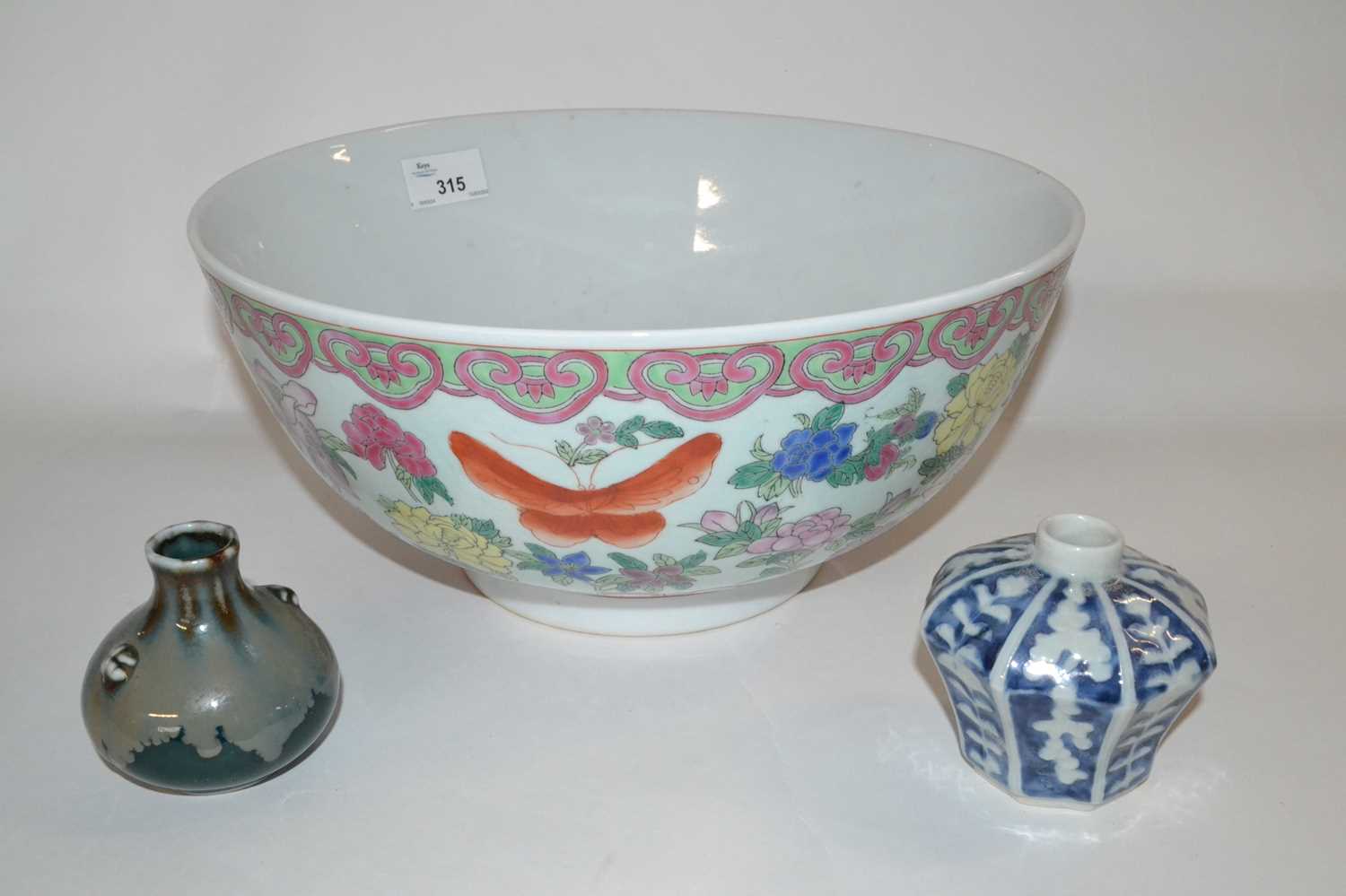 A large Chinese porcelain punch bowl, 20th Century with a polychrome design of flowers together with - Image 2 of 3