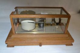 Negretti & Zambra, London, a light oak cased barograph of typical form, 42cm wide max