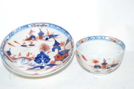 A Lowestoft porcelain tea bowl and saucer in Redgrave style with the dolls house pattern, (chip to