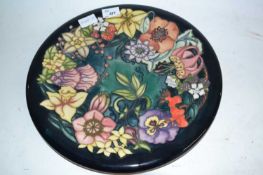A modern Moorcroft charger with tubelined pattern of the carousel signed to the base by Rachel