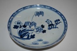 A Liverpool Chaffers saucer with blue and white design within hatched border, 12cm diameter