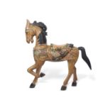 A large Italian carved wooden model of a prancing horse decorated in polychrome, approx 130cm high