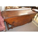 Large oak drop leaf dining or wake table in the 18th Century style with turned gate legs, probably