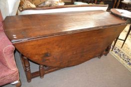 Large oak drop leaf dining or wake table in the 18th Century style with turned gate legs, probably