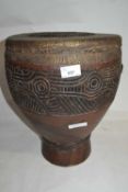 Ethnographica/tribal interest - An unusual carved wooden drum, the top covered with snake or reptile