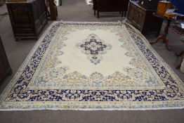 A modern Kirman beige wool floor rug with geometric and floral border, 3.58 x 2.70 metres