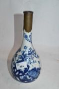A Chinese porcelain vase, baluster body with blue and white decoration and metal repair to rim