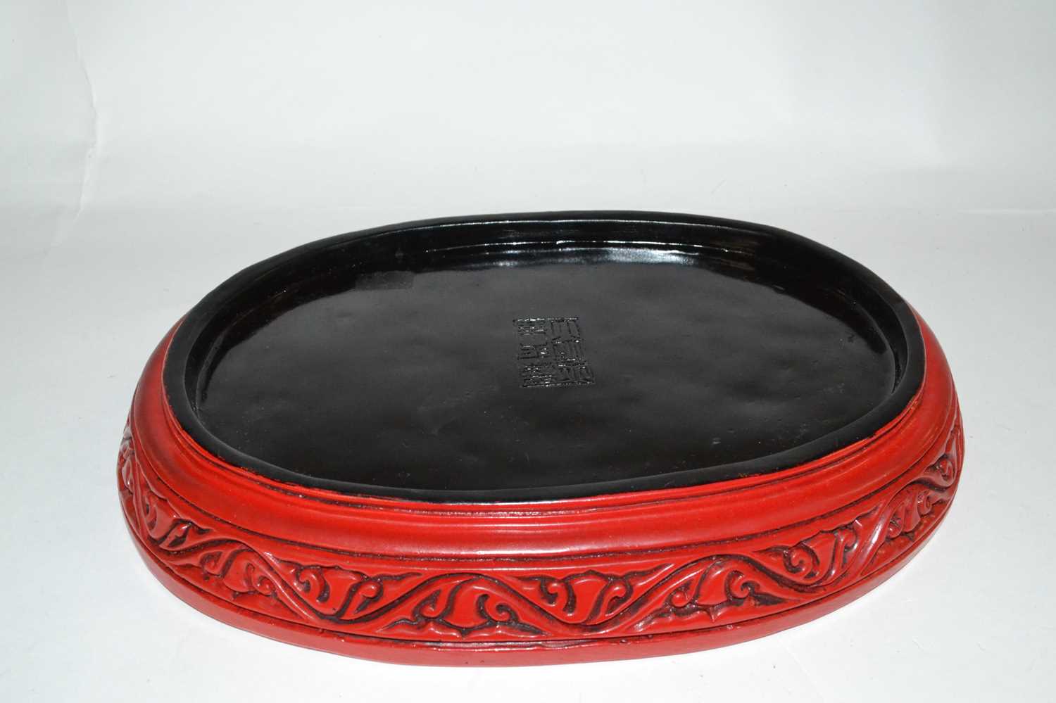 A Chinese red lacquer dish with raised relief decoration of berries and leaves, seal mark to base, - Image 3 of 4