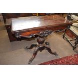 A Victorian rosewood pedestal card table with folding baize lined top, raised on a bulbous column