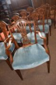 A set of eight 20th Century arch back dining chairs with wheatsheaf decoration and blue