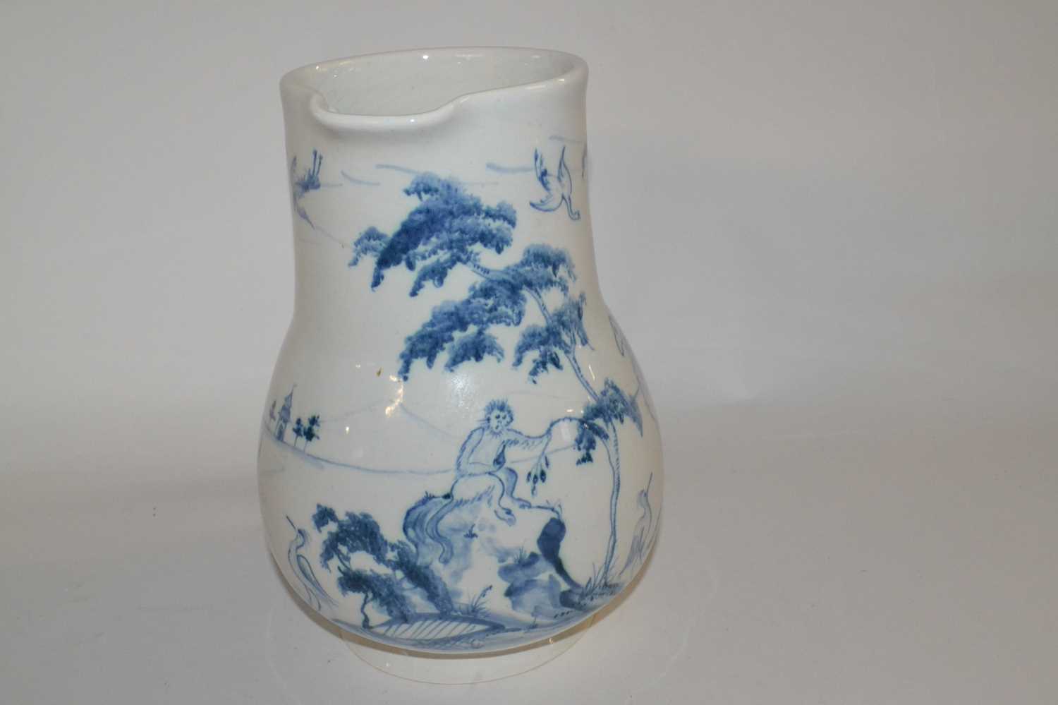 A Isis Ceramics type jug decorated with a camel and a monkey in Delft style, slightly crazed, - Image 2 of 3