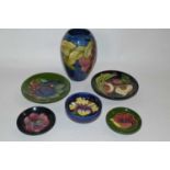 A group of Moorcroft wares including a vase decorated with Anemones, small pin dish with Hibiscus on