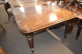 A Victorian mahogany extending dining table on tapering legs with casters, 128cm wide, no extra