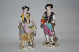 Two late 19th Century continental porcelain figures, one of a gardener and of a lady flower