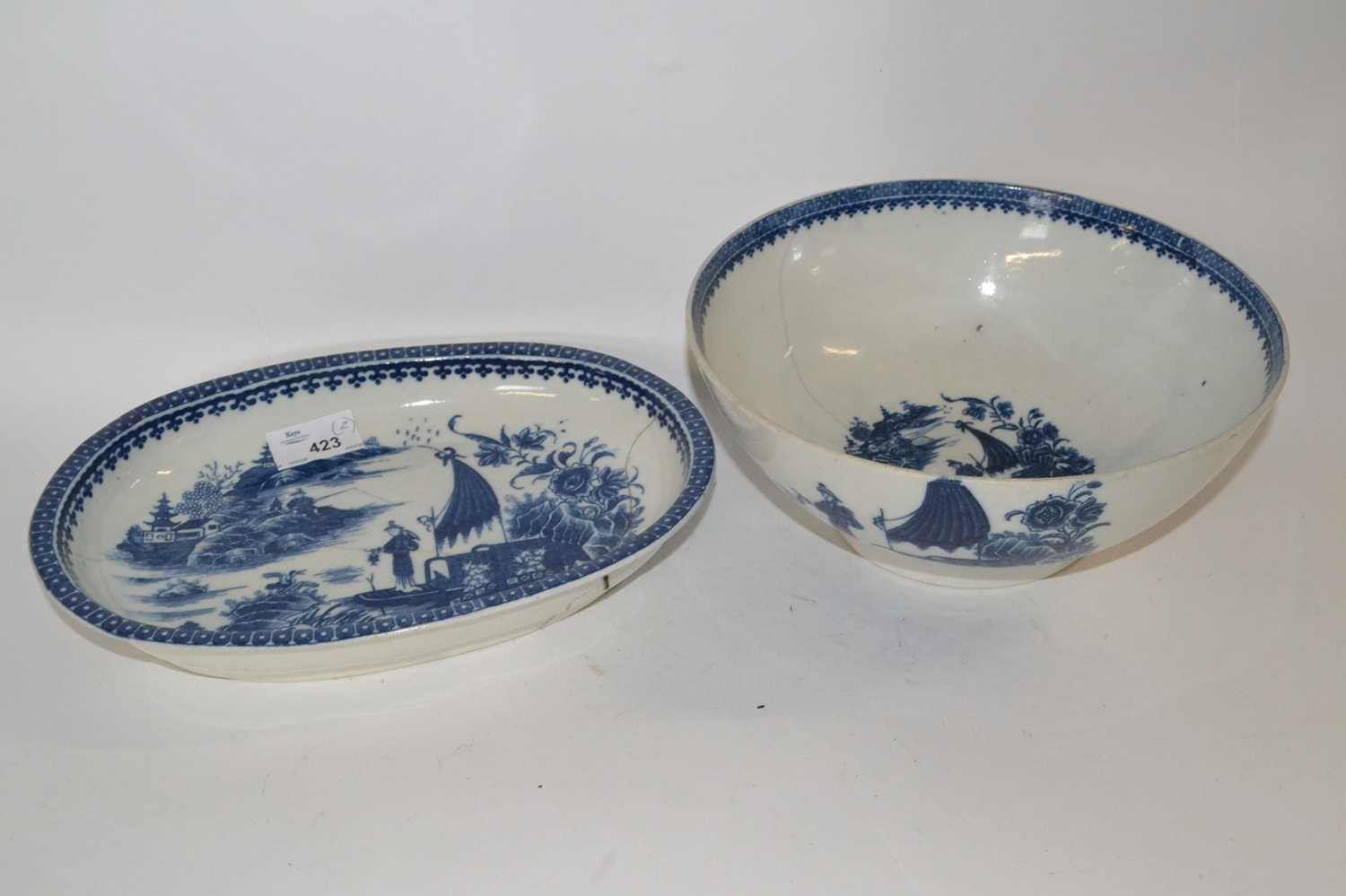 A large 18th Century Caughley bowl with the fisherman pattern together with a further oval shaped