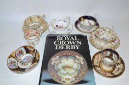 A group of mid 19th Century English porcelain cups and saucers all with typical painted floral