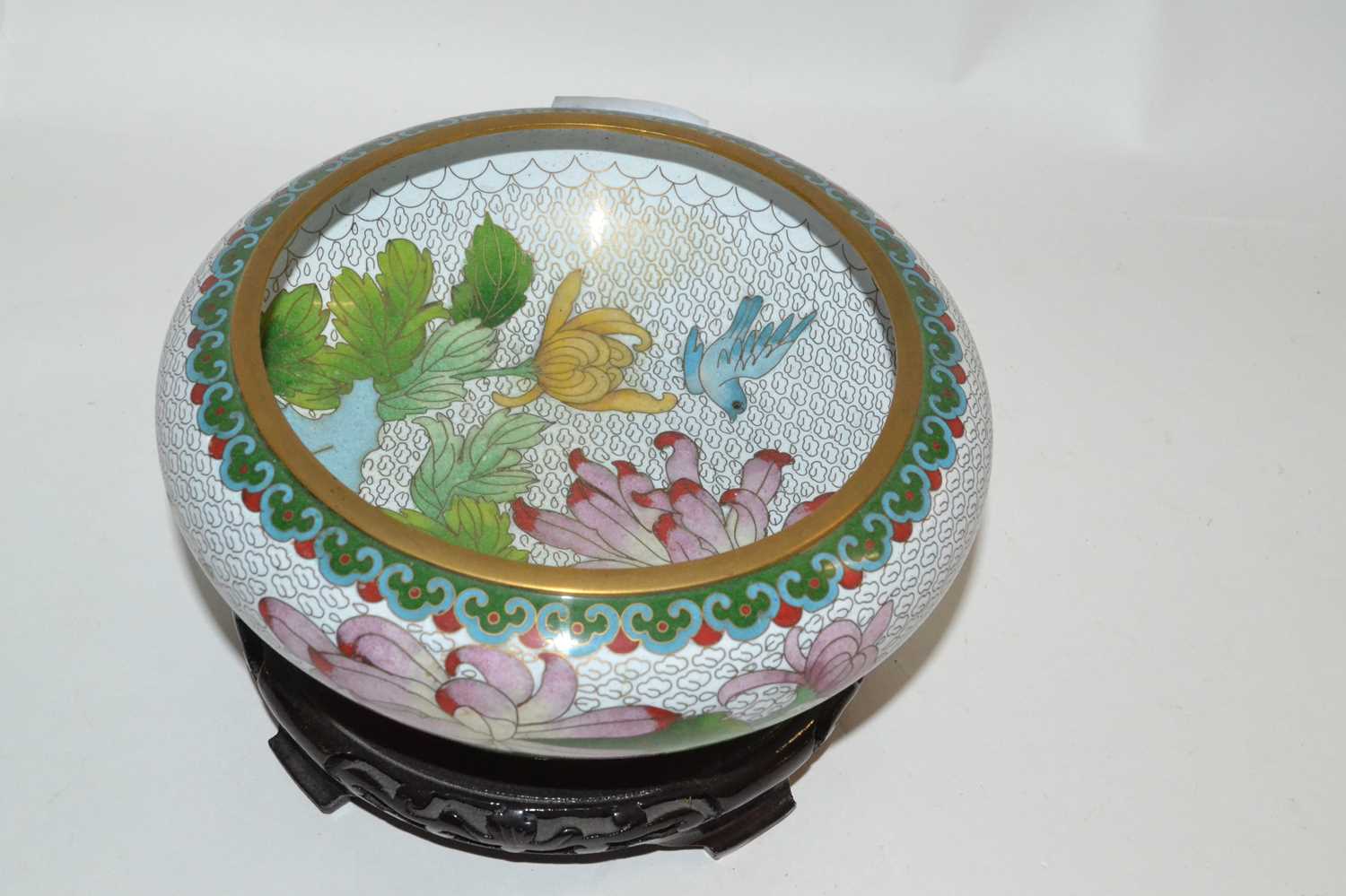 A modern Cloisonne bowl and stand, the bowl decorated with a floral design, 18cm high