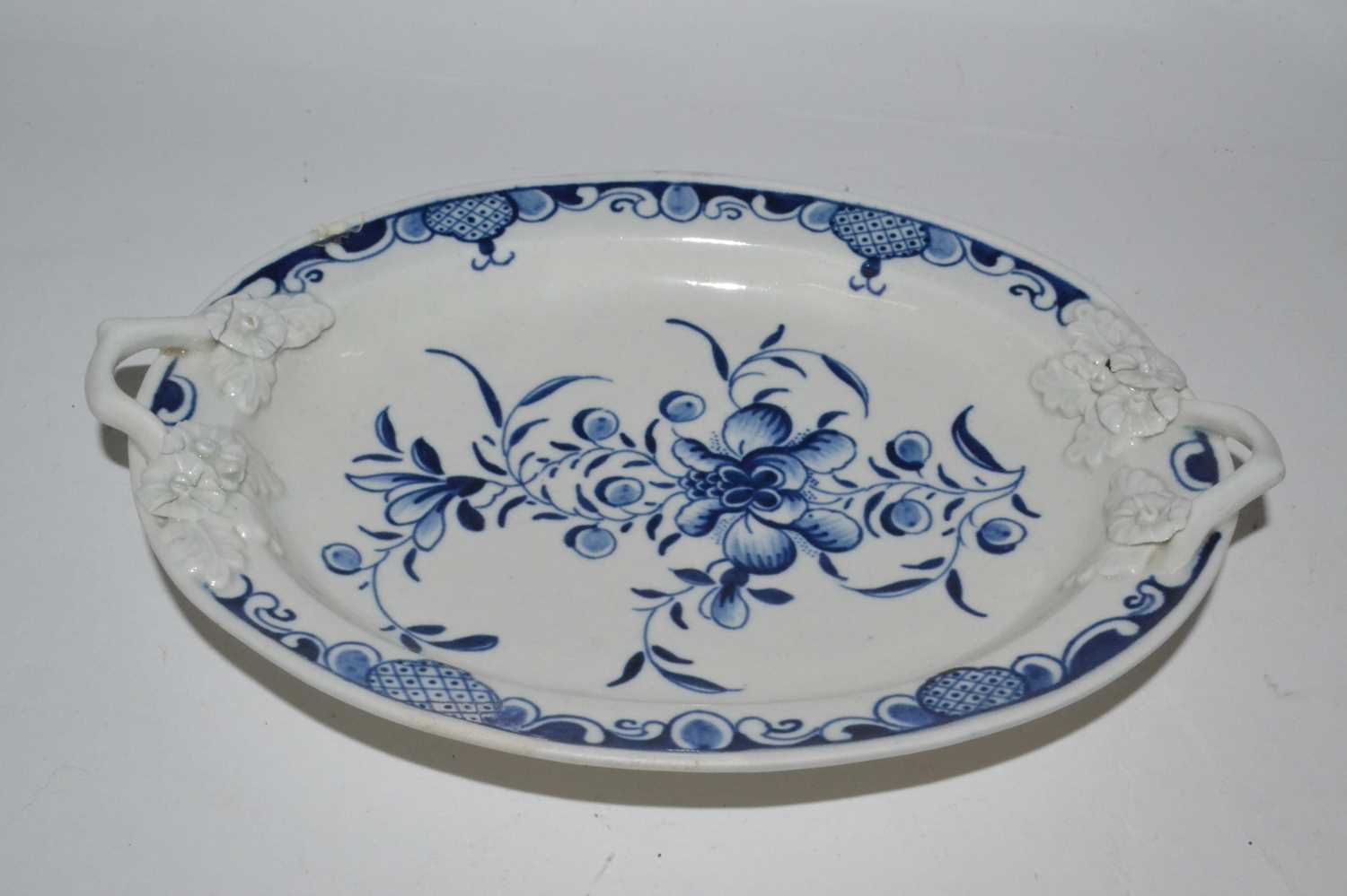 A small 18th Century Worcester porcelain stand decorated in under glaze blue with crescent mark to