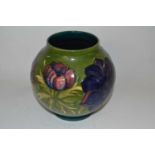 A Moorcroft vase of globular form, the green ground with tubelined Anemone design