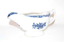 A large 18th Century Lowestoft porcelain sauce boat, the body with a moulded floral design decorated