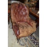 Victorian red leather upholstered small armchair with turned legs, extremely worn and distressed