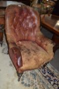 Victorian red leather upholstered small armchair with turned legs, extremely worn and distressed