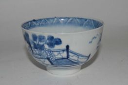 An English porcelain tea bowl, 18th Century with blue and white design