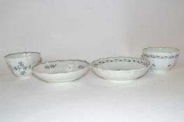 Two Lowestoft porcelain tea bowls and saucers, circa 1780/90, one of fluted form with feather type