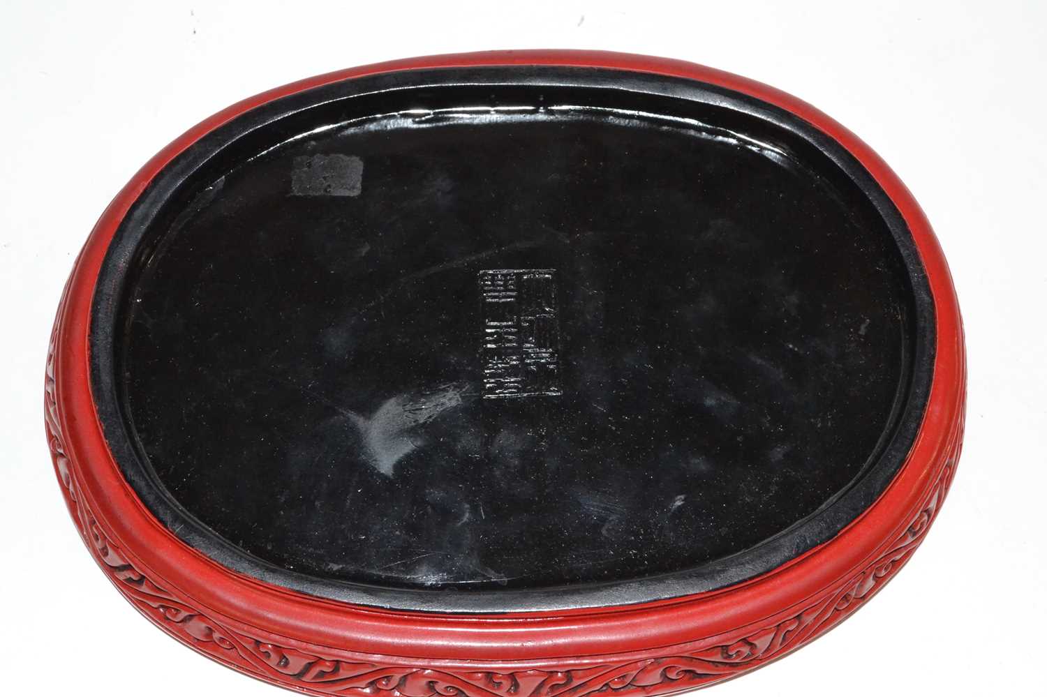 A Chinese red lacquer dish with raised relief decoration of berries and leaves, seal mark to base, - Image 4 of 4