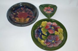 A group of Moorcroft wares including a Pomegranate pattern dish, further dish with Anemone pattern