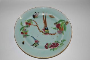 A Cantonese plate, the celadon ground painted with birds and fruit together with bugs and