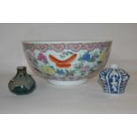 A large Chinese porcelain punch bowl, 20th Century with a polychrome design of flowers together with