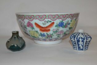 A large Chinese porcelain punch bowl, 20th Century with a polychrome design of flowers together with