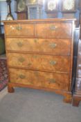 A Georgian walnut chest of two short over three long drawers raised on bracket feet, 94cm wide