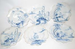 A group of six shaped Isis Ceramics plates with various Delft type designs, from the Exotic