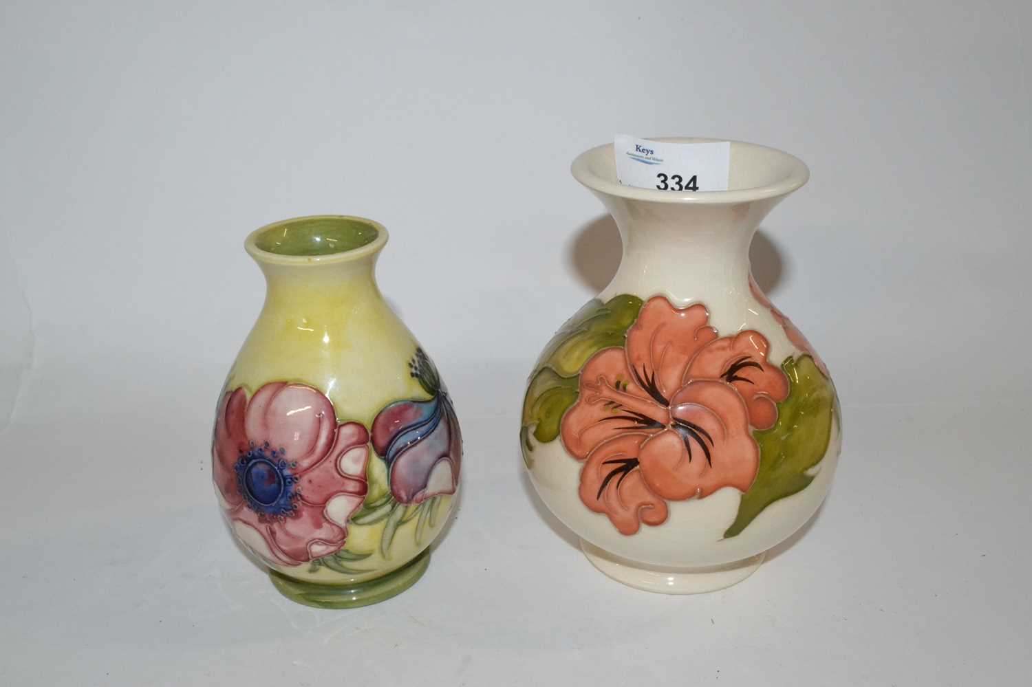 A Moorcroft vase of small baluster form, the yellow ground with tubelined anemone design with