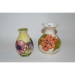 A Moorcroft vase of small baluster form, the yellow ground with tubelined anemone design with