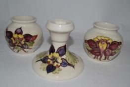 A pair of Moorcroft small vases, decorated with the Columbine pattern on white ground together