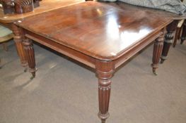 A Victorian mahogany dining table on fluted legs, 120cm wide