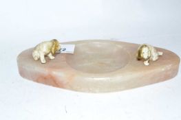 An onyx ashtray mounted with two painted dogs