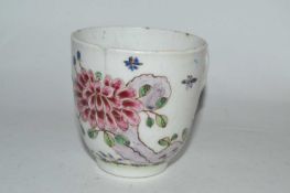 A Bow porcelain cup circa 1755 with famille rose design and Tau handle, 6cm high (hairline)