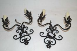 A pair of iron wall sconce light fittings, 26cm high max