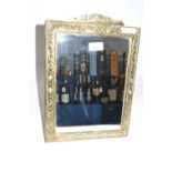 An early 20th Century brass framed rectangular dressing table mirror with bevelled glass, 38cm high